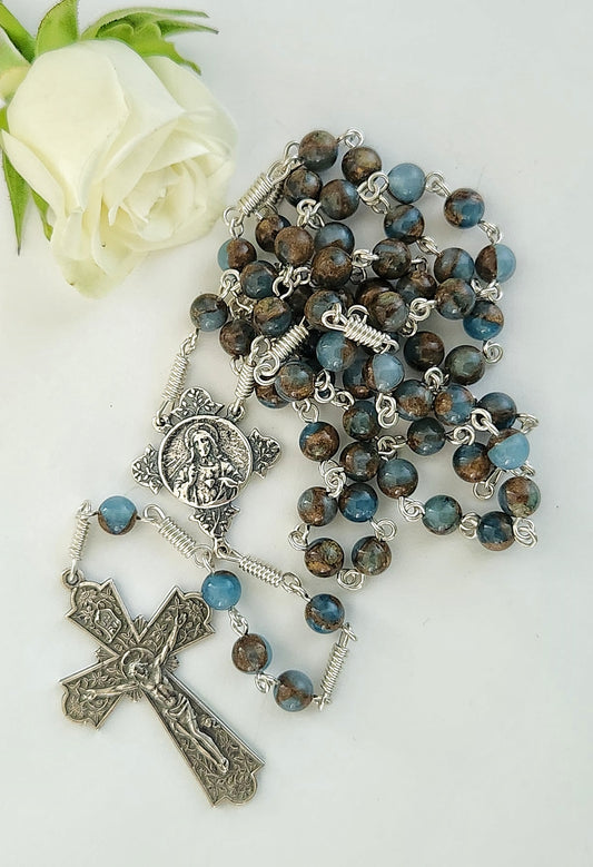 Brown and blue aquamarine beads with sterling silver sacred heart centerpiece  and crucifix