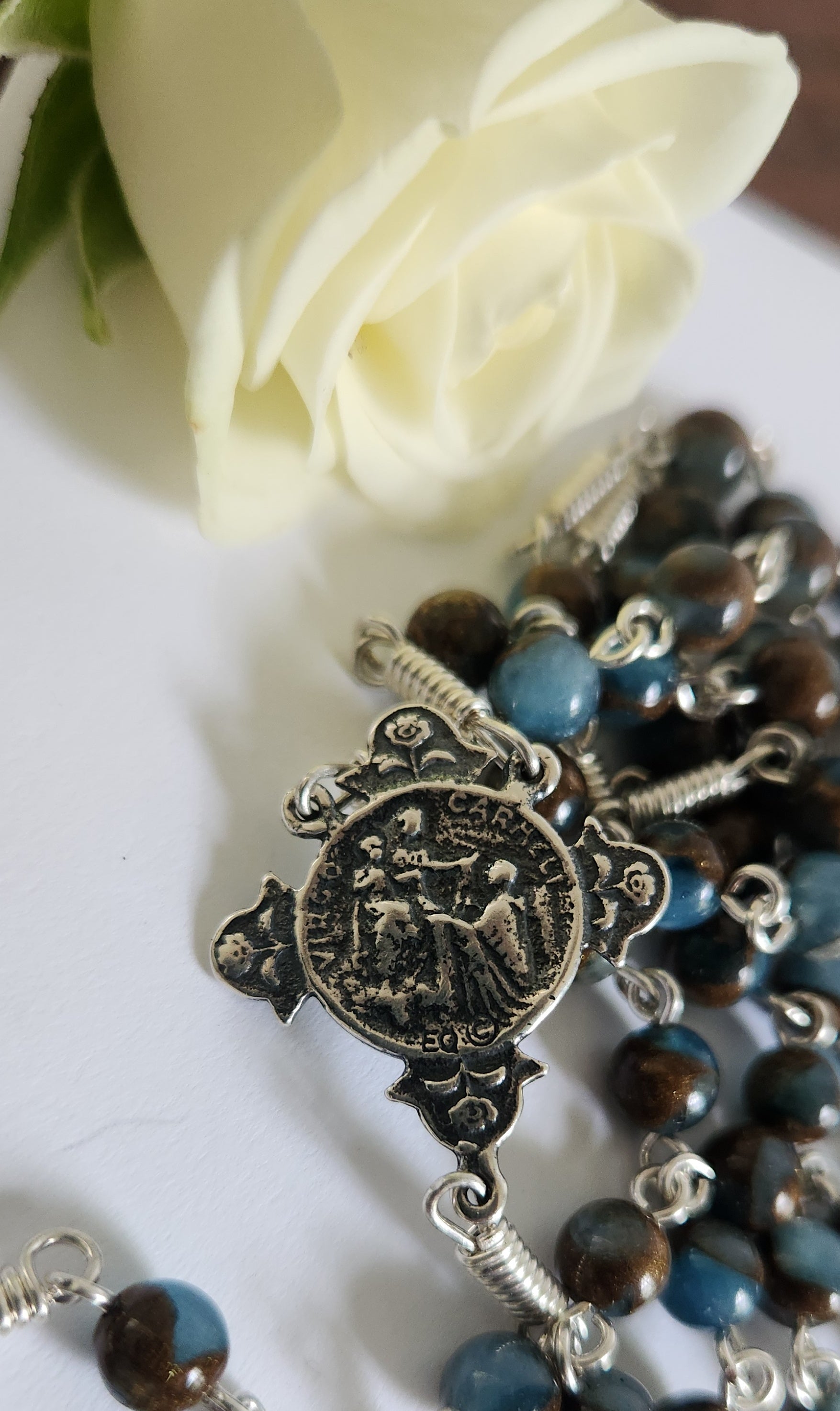 Brown and blue aquamarine beads with sterling silver sacred heart centerpiece  and crucifix