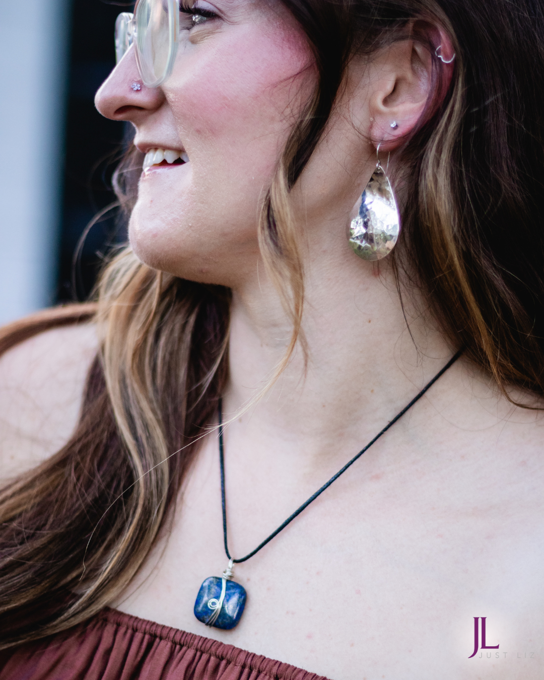 Woman wearing this silver wire wrapped square shaped lapis stone necklace