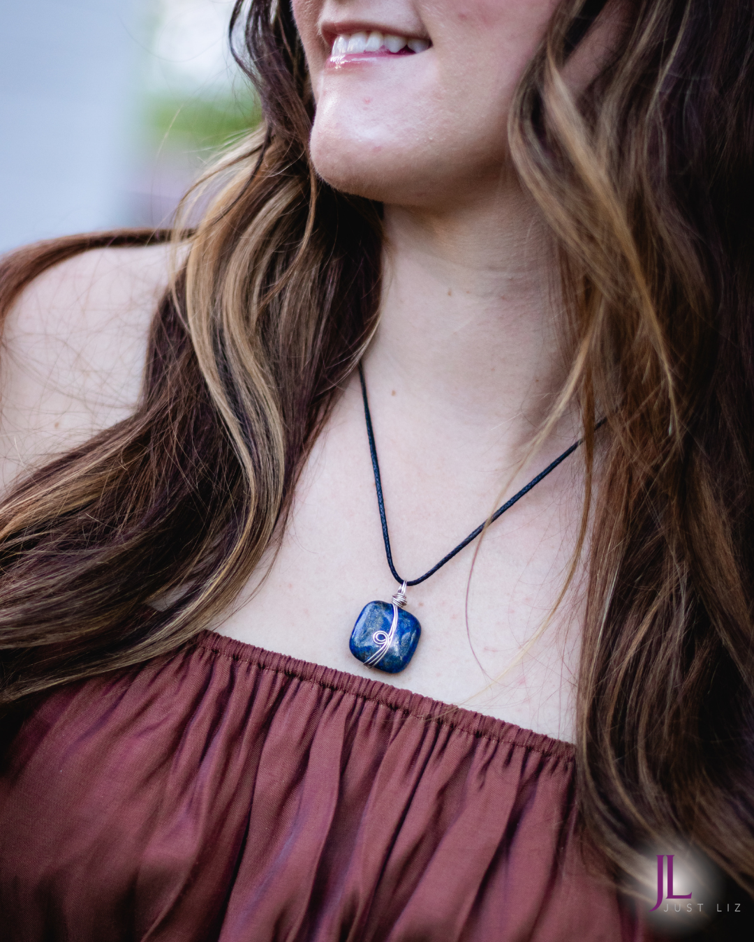 Woman wearing this silver wire wrapped square shaped lapis stone necklace