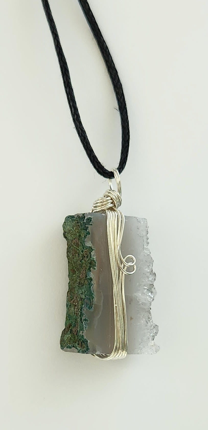 A rectangular blue and green stone necklace