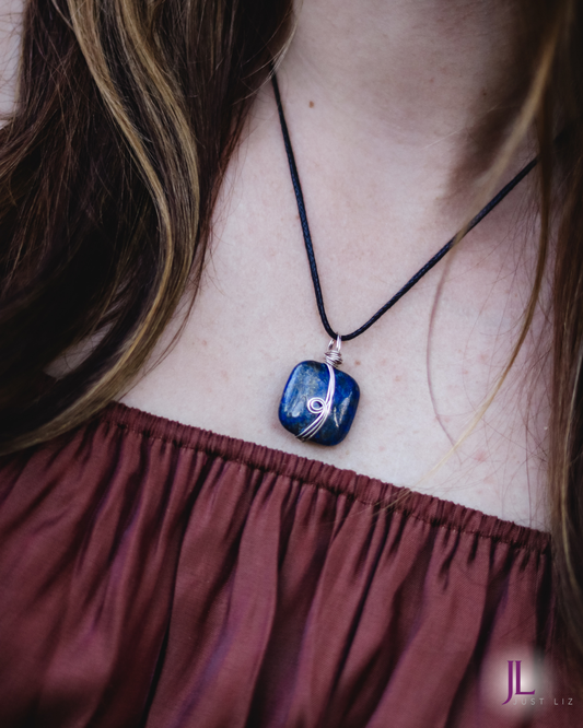 Woman wearing this silver wire wrapped square shaped lapis stone necklace